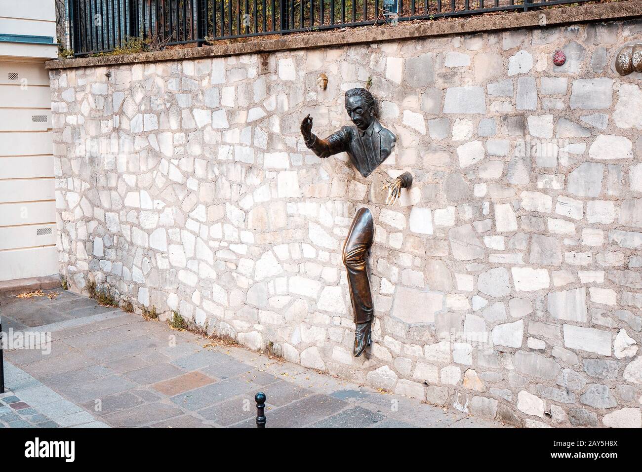 25 July 2019, Paris, France: Sculpture of a man passing through the walls of the novel by the writer Marcel Aime Stock Photo