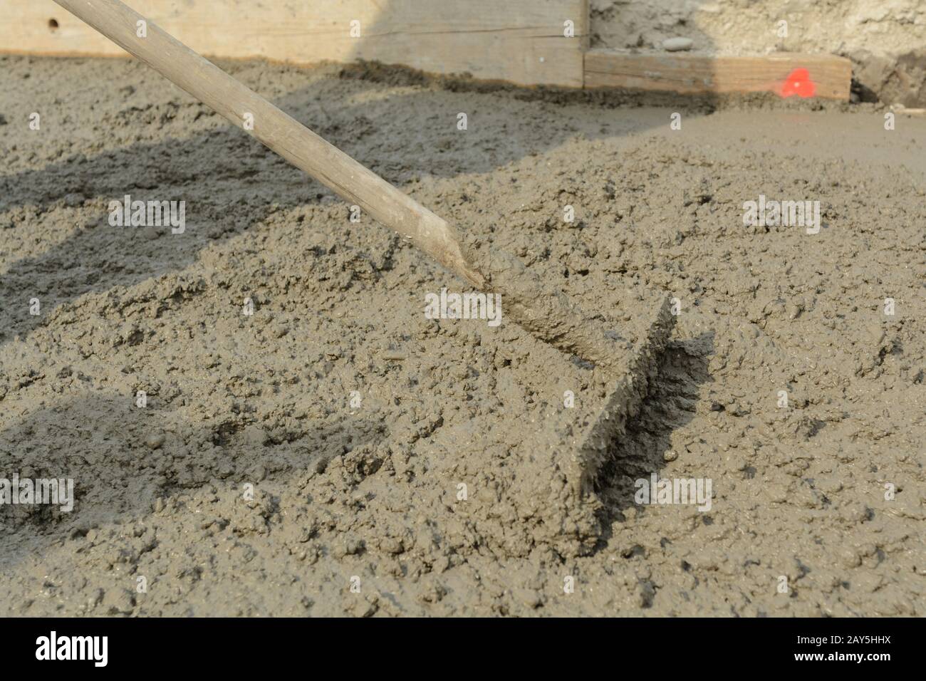Concrete mixture is smoothed on site with iron rakes Stock Photo Alamy