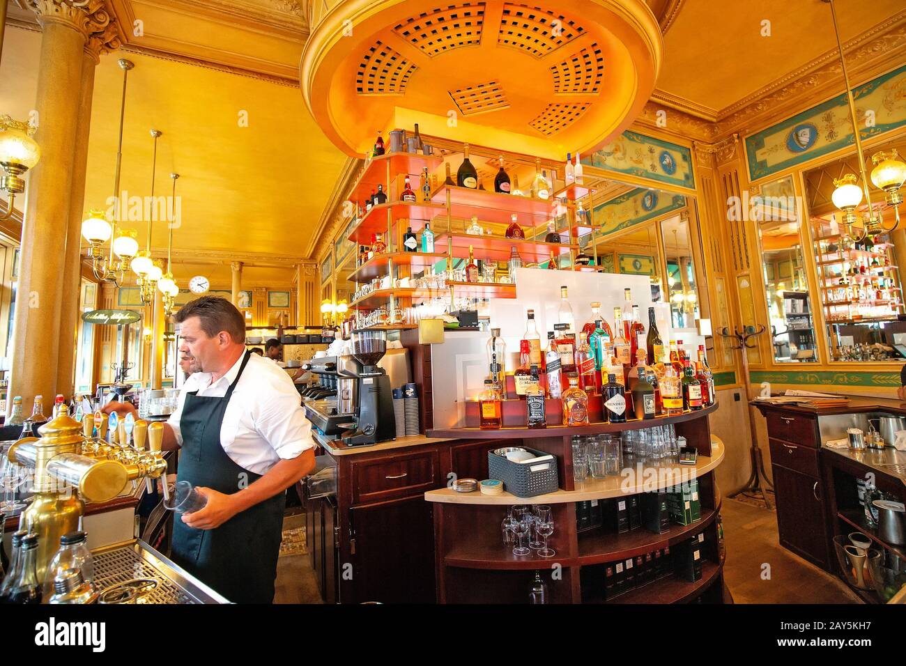 26 July 2019, Paris, France: Barman serving alcohol cocktails in retro bar. Stock Photo