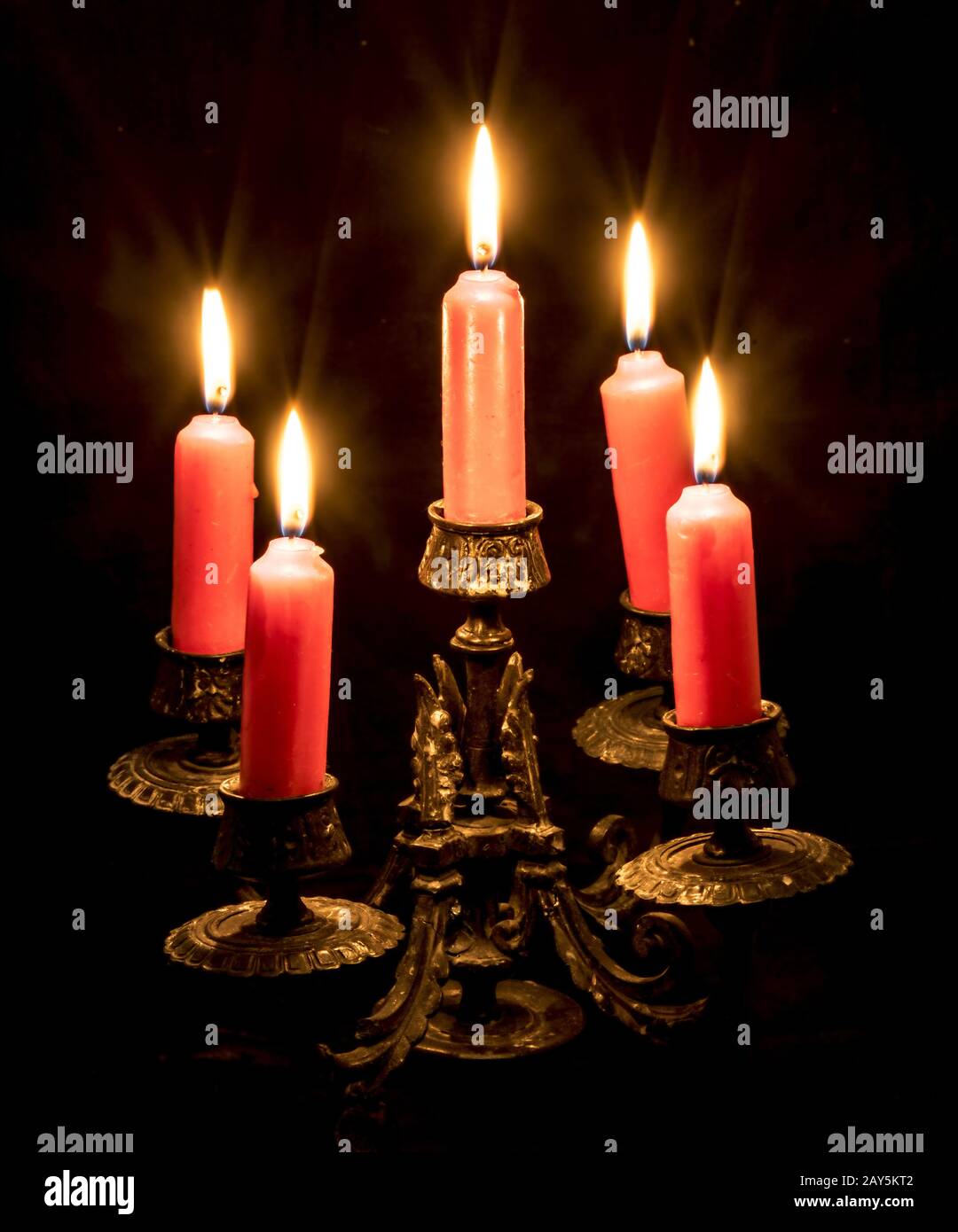 candlestick with burning candles Stock Photo - Alamy