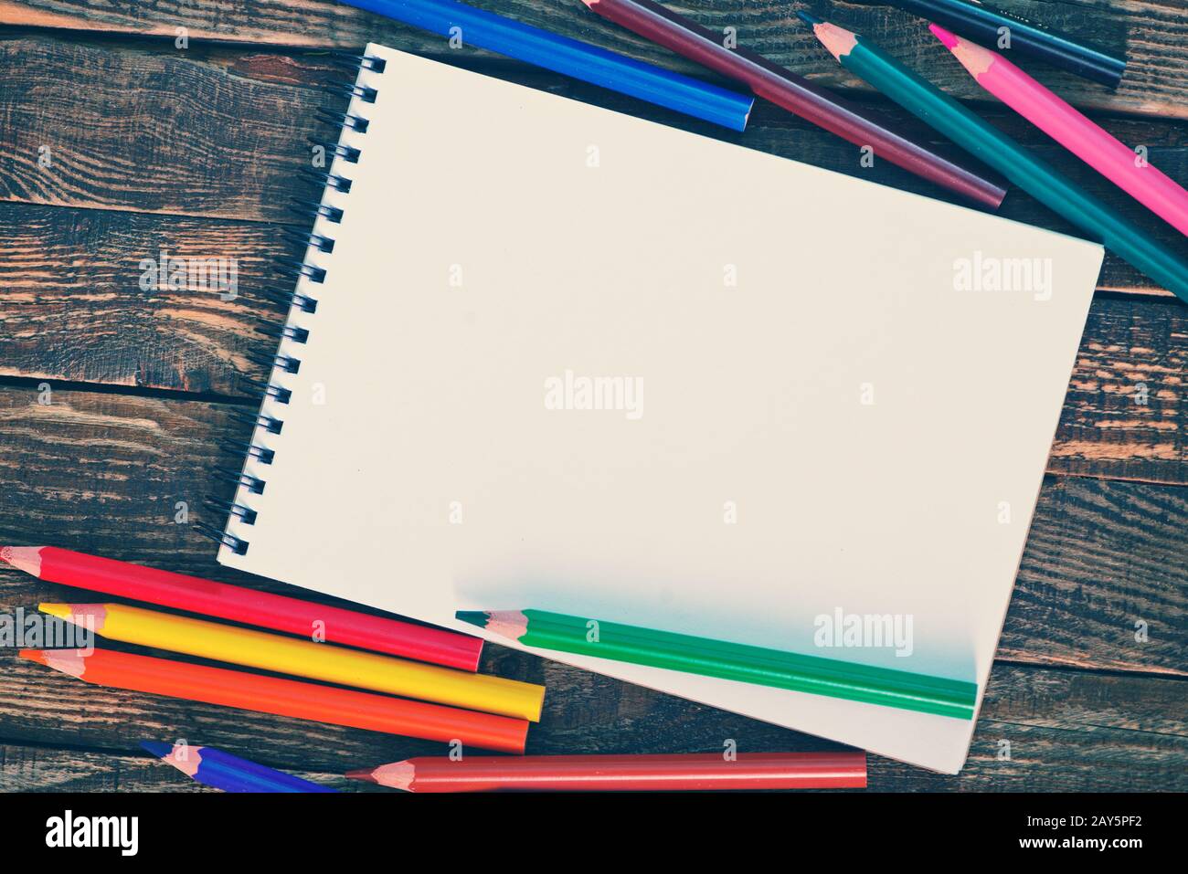 Note and pencils Stock Photo - Alamy