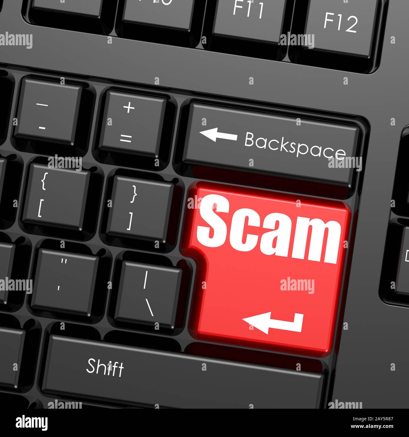 Red enter button on computer keyboard, Scam word Stock Photo