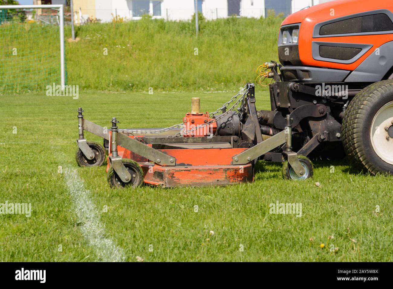 Sports facility is mowed with lawn tractor - Lawn care Stock Photo