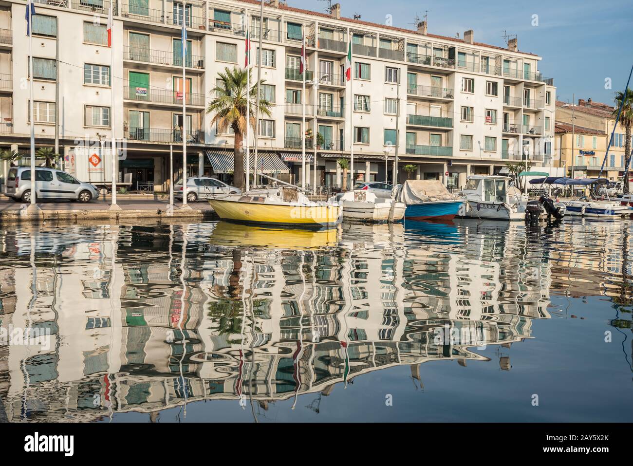 A modern facade of European city house is unusually reflected in the water Stock Photo