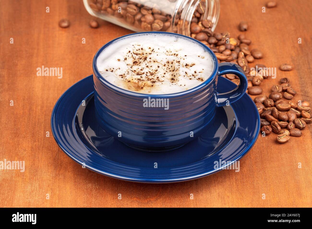 coffee cup and beans, on wooden table Stock Photo