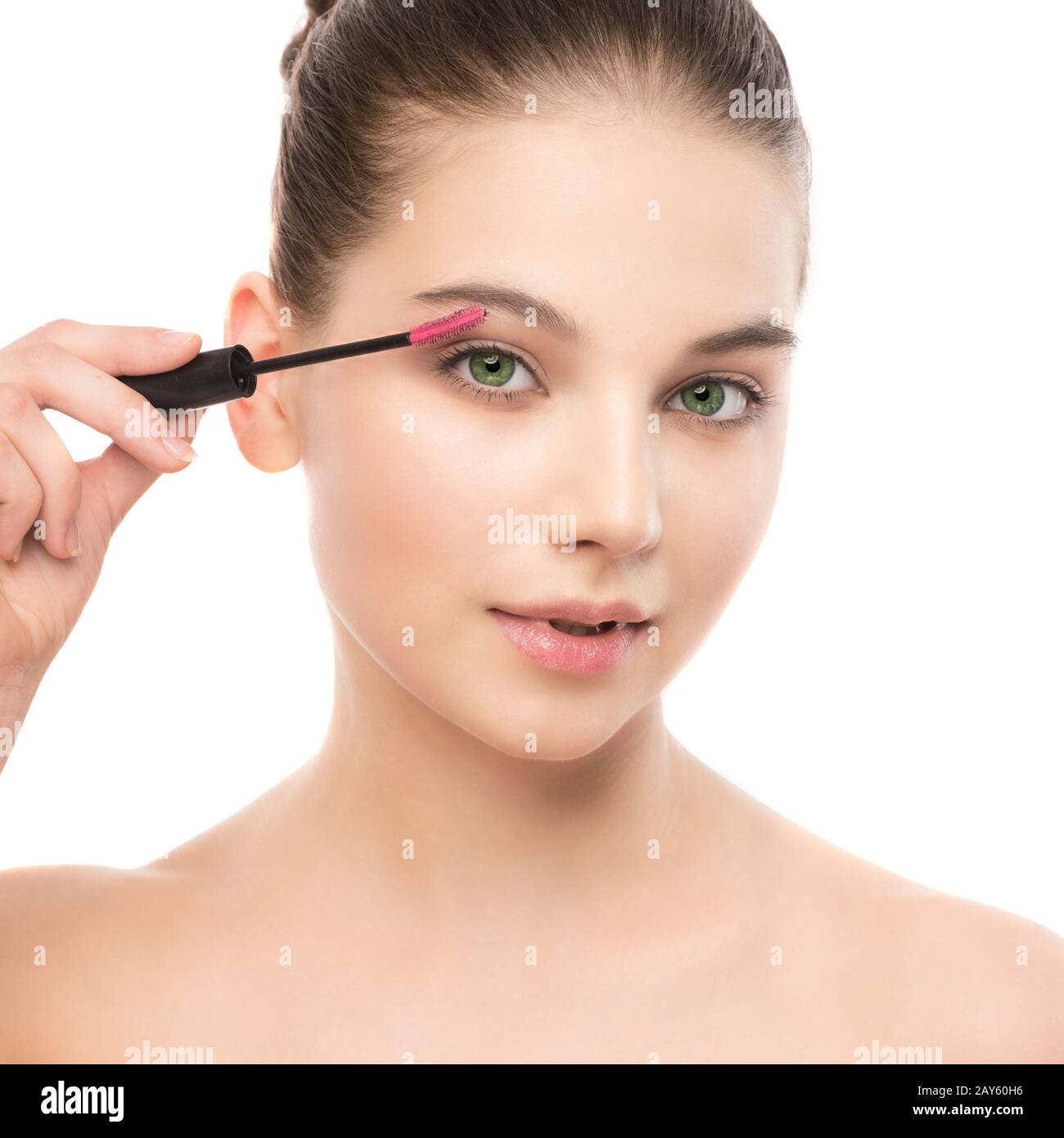 Eye make up apply. Mascara applying closeup, long lashes. makeup brush. Isolated. Stock Photo