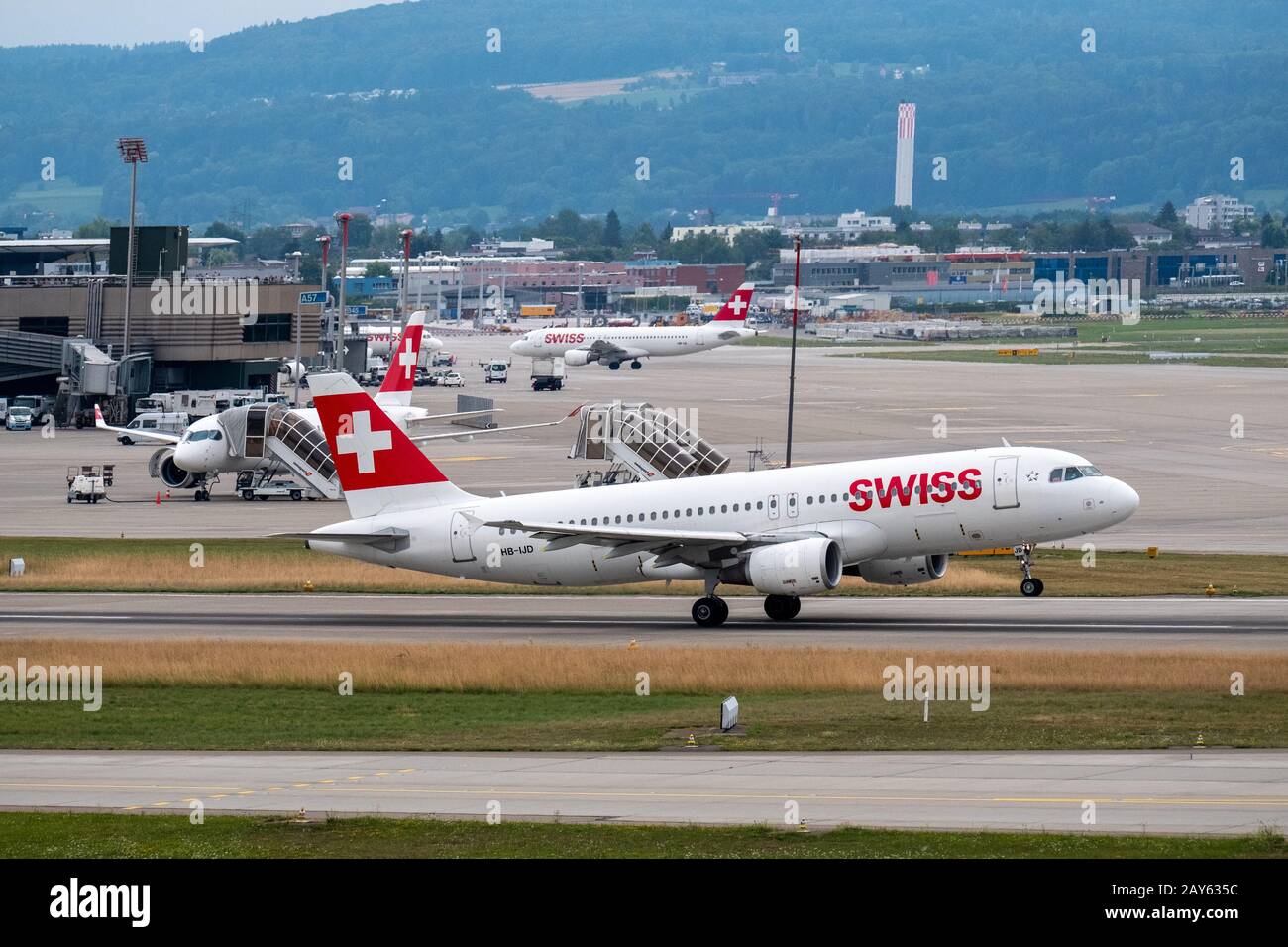 Swiss airlines airplanes preparing for take-off at day time in ...