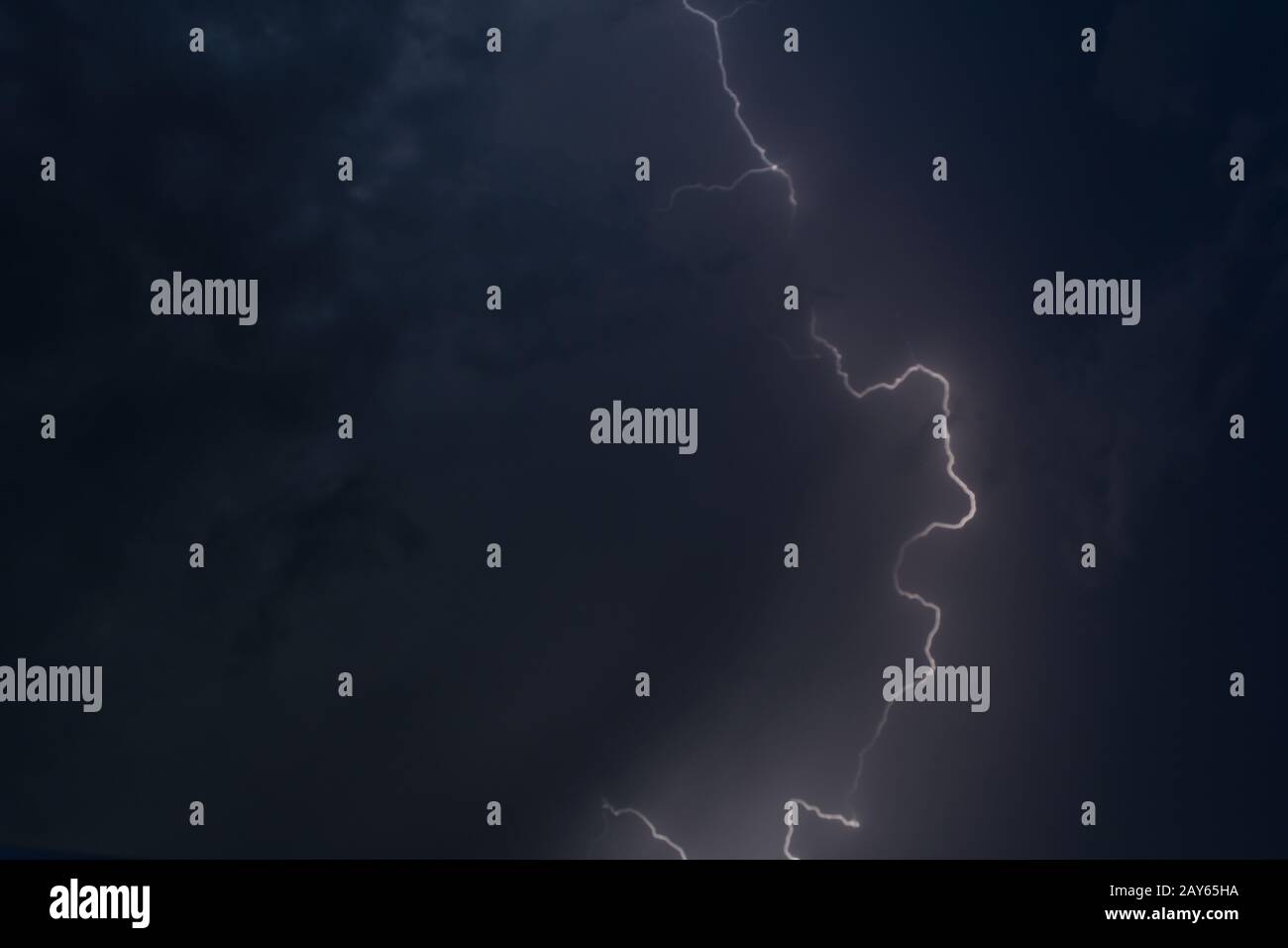 Lightning in a gloomy sky - impressive thunderstorm Stock Photo