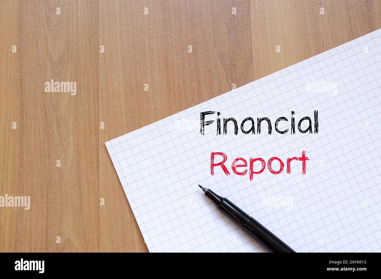 Financial report text concept on notebook Stock Photo