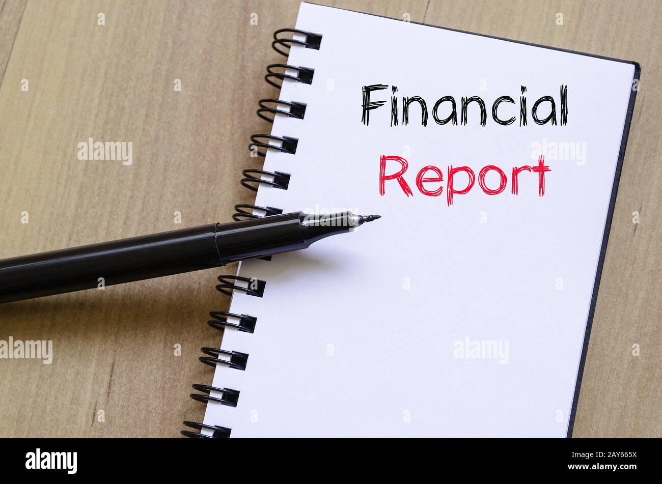Financial report text concept on notebook Stock Photo