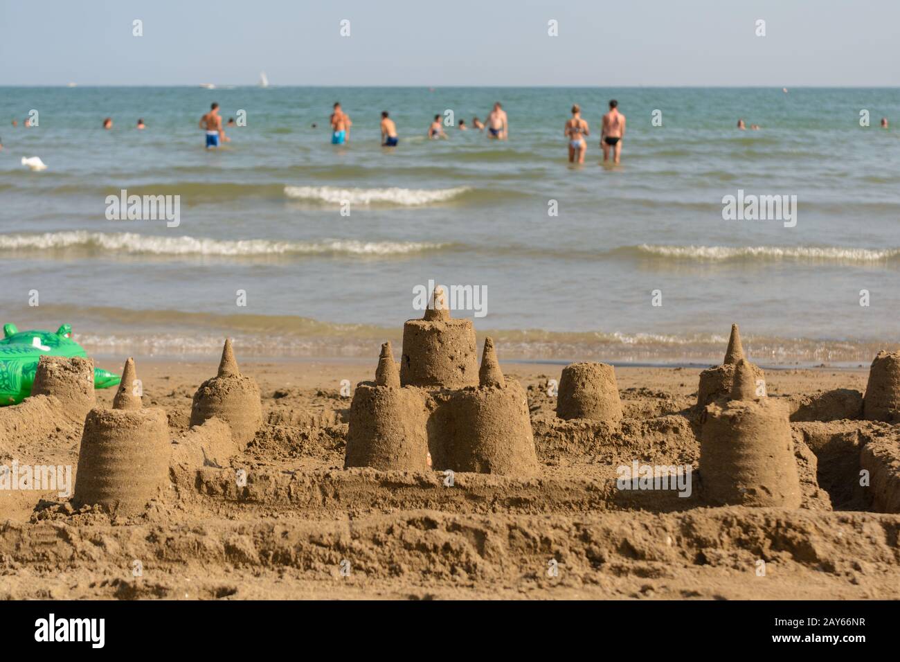 several sandcastles on the beach in front of the coast - beach holiday Stock Photo