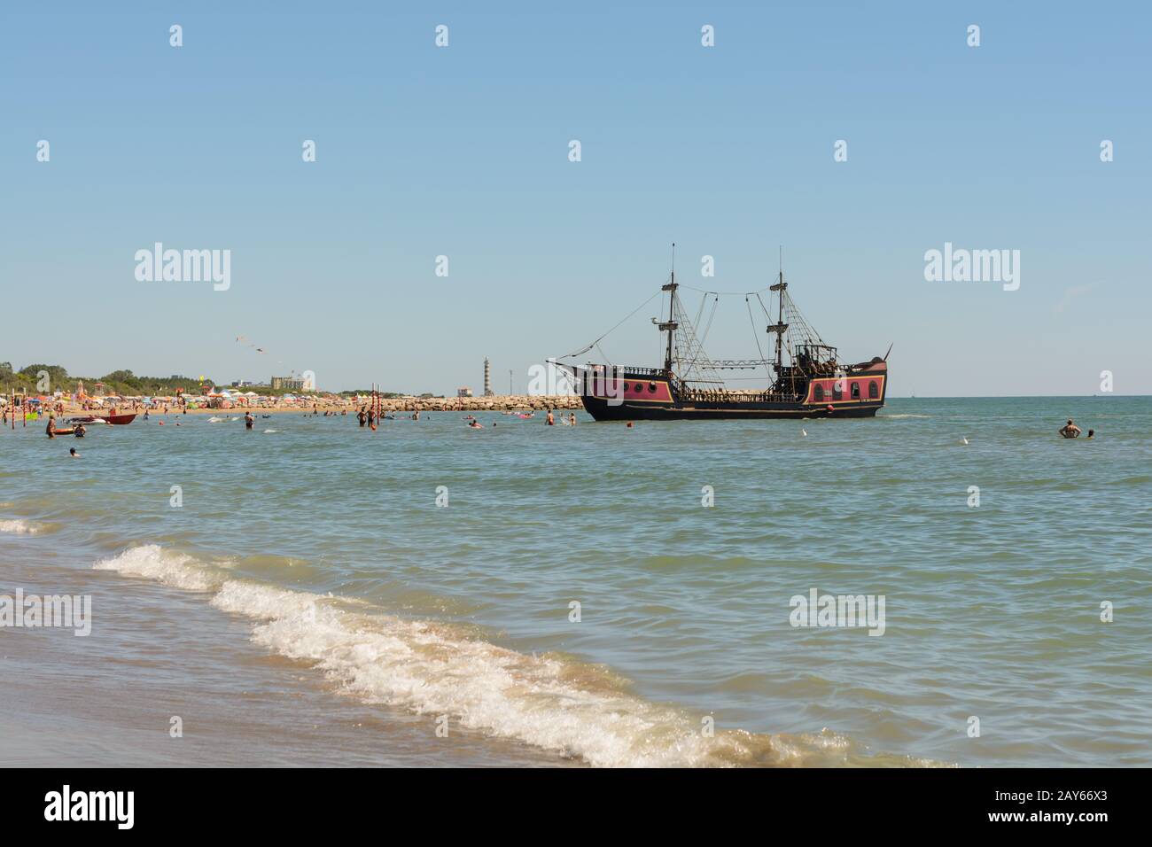 Old pirate ship on the beach is available for travel - Italy Stock Photo