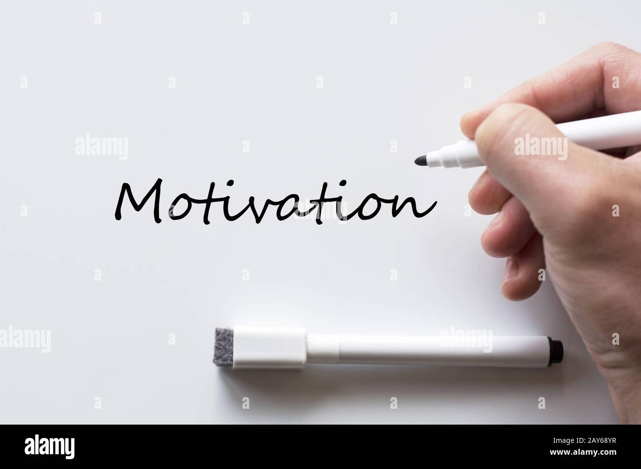 Motivation written on whiteboard Stock Photo
