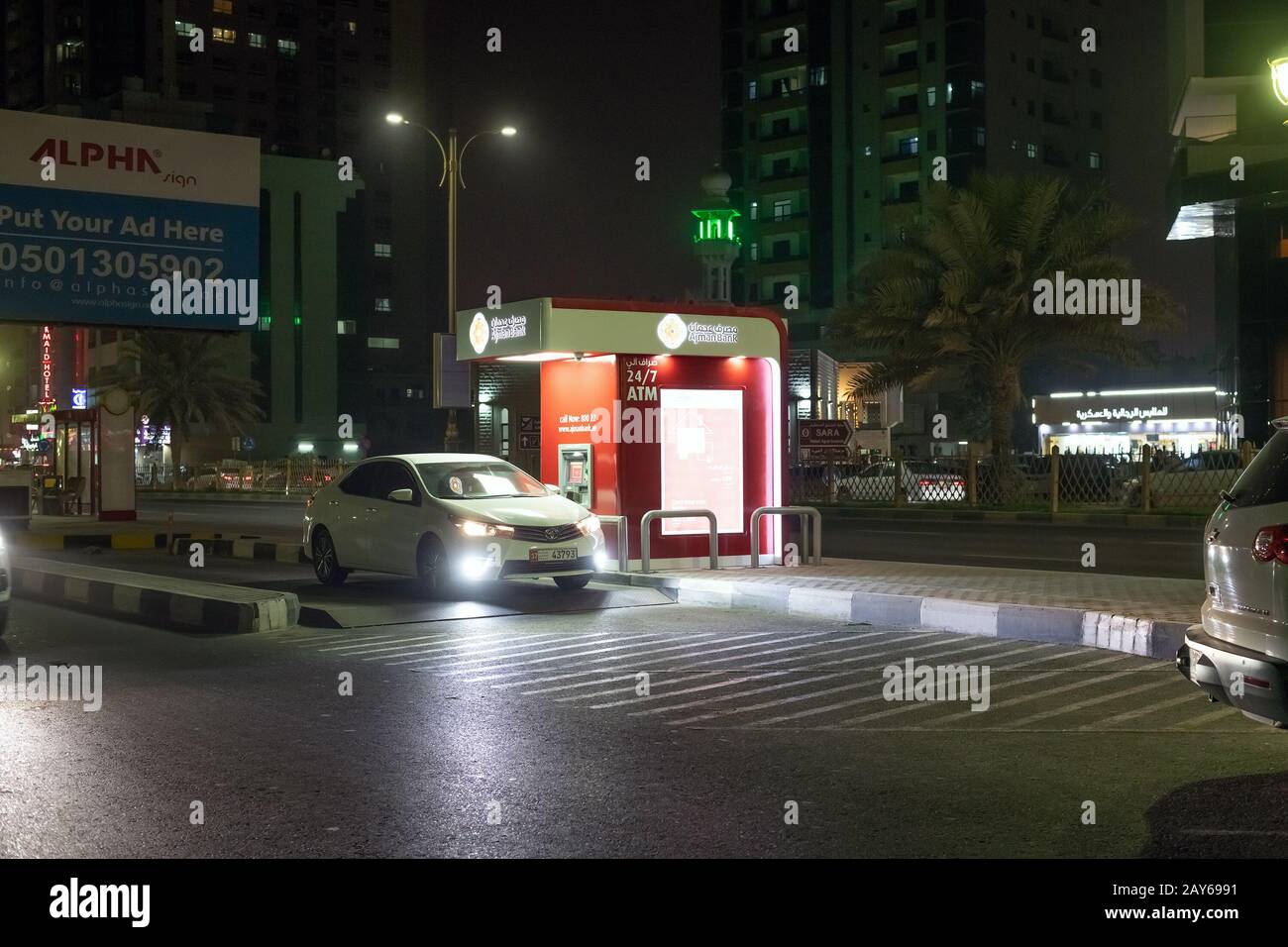 Ajman, UAE - April 6. 2018. ATM Ajman bank at edge of road to use without leaving car. Local tradition Stock Photo