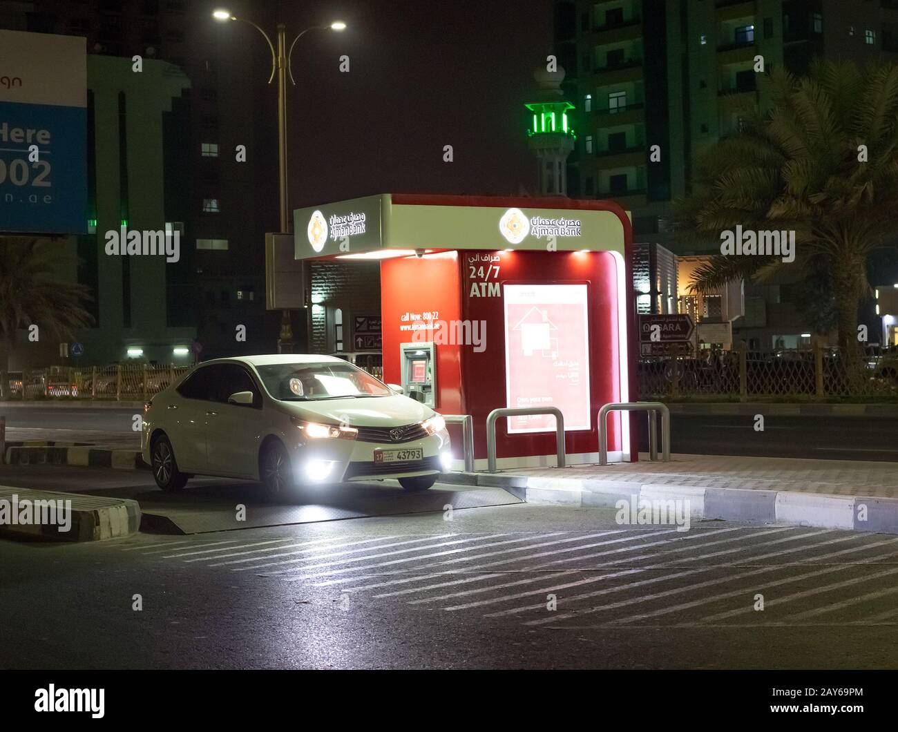 Ajman, UAE - April 6. 2018. ATM Ajman bank at edge of road to use without leaving car. Local tradition Stock Photo