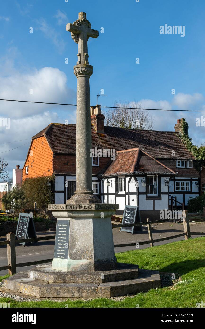 Village of Newdigate, Surrey, UK, with the war memorial and pub called The Six Bells Stock Photo