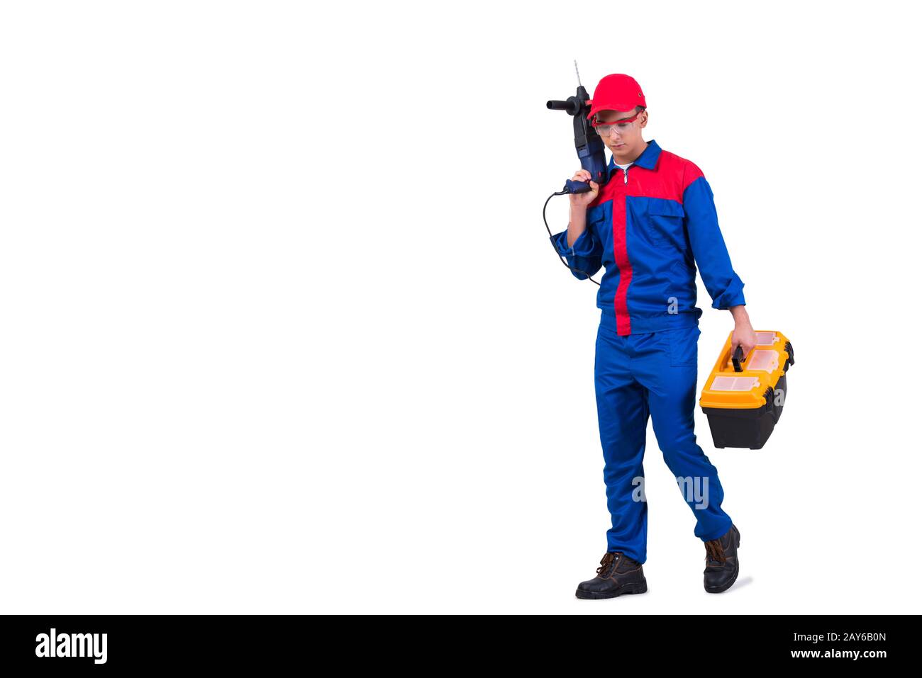 Young repairman with drill perforator isolated on white Stock Photo