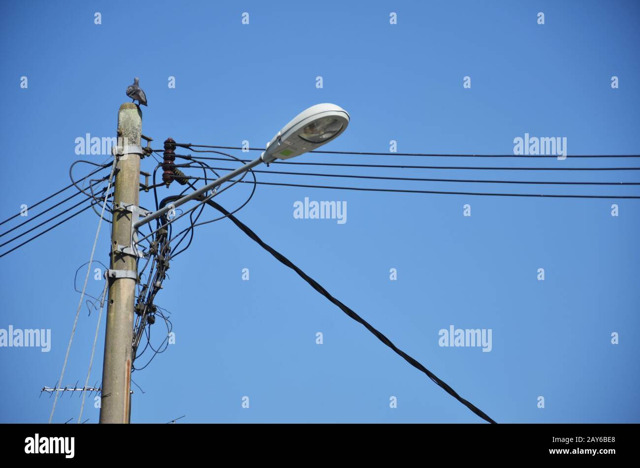 Lamp post with many cables Stock Photo Alamy