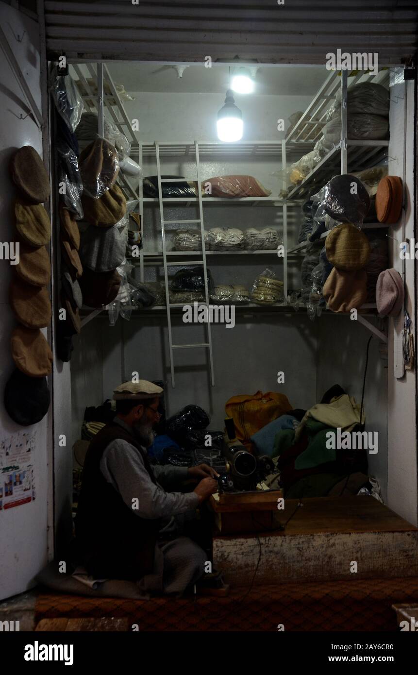 February 8, 2020: Peshawar, Pakistan. A traditional workshop producing handmade woollen Chitrali Patti hats. The caps are made from sheep wool, or Chitrali patti. The wool has been named after the Chitral valley in the north west frontier of Pakistan, a district of Pakistan famous for the production of sheep wool caps and other sheep wool garments used for protection during severe winter conditions. The Chitrali Bazar in Peshawar.is popular for the sale of Chitrali hats and other woollen garments Credit: Hasnain Ali/IMAGESLIVE/ZUMA Wire/Alamy Live News Stock Photo