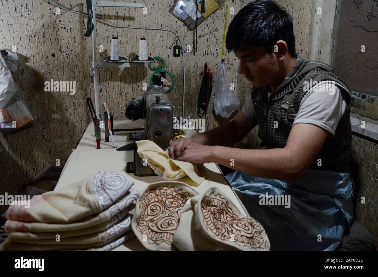 February 8, 2020: Peshawar, Pakistan. A traditional workshop producing handmade woollen Chitrali Patti hats. The caps are made from sheep wool, or Chitrali patti. The wool has been named after the Chitral valley in the north west frontier of Pakistan, a district of Pakistan famous for the production of sheep wool caps and other sheep wool garments used for protection during severe winter conditions. The Chitrali Bazar in Peshawar.is popular for the sale of Chitrali hats and other woollen garments Credit: Hasnain Ali/IMAGESLIVE/ZUMA Wire/Alamy Live News Stock Photo