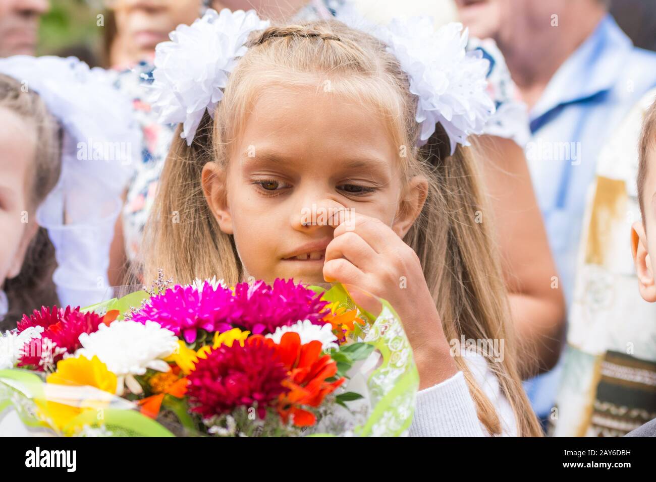 First grader on the first line in September picking his nose Stock Photo