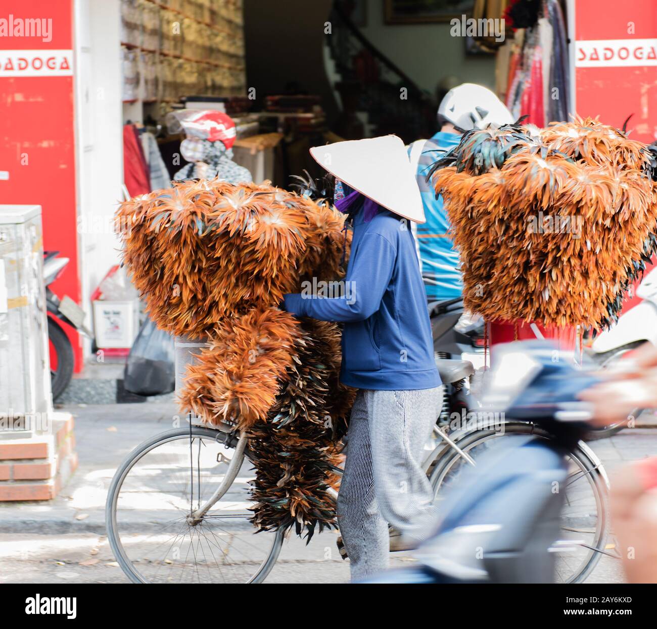 Vietnamese street vendors act and sell their vegetables and fruit products in Hanoi, Vietnam Stock Photo