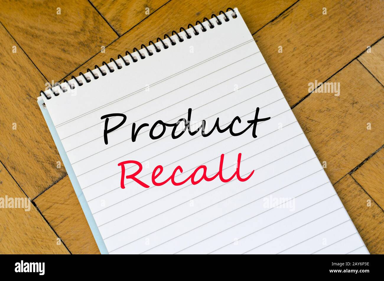 Human hand over wooden background and product recall text concept Stock ...