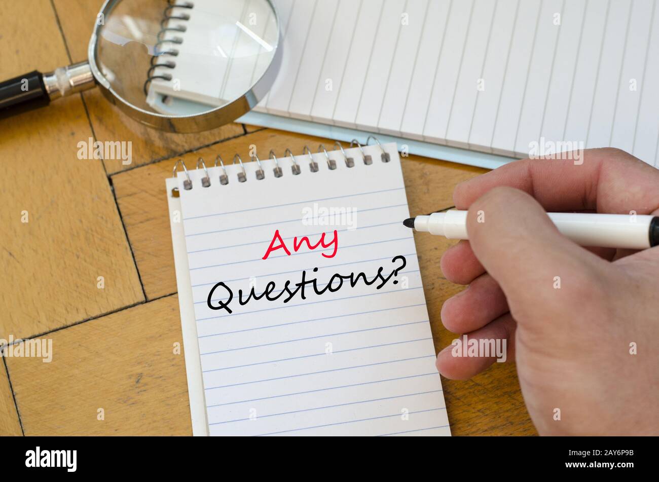 Human hand over wooden background and any questions text concept Stock ...