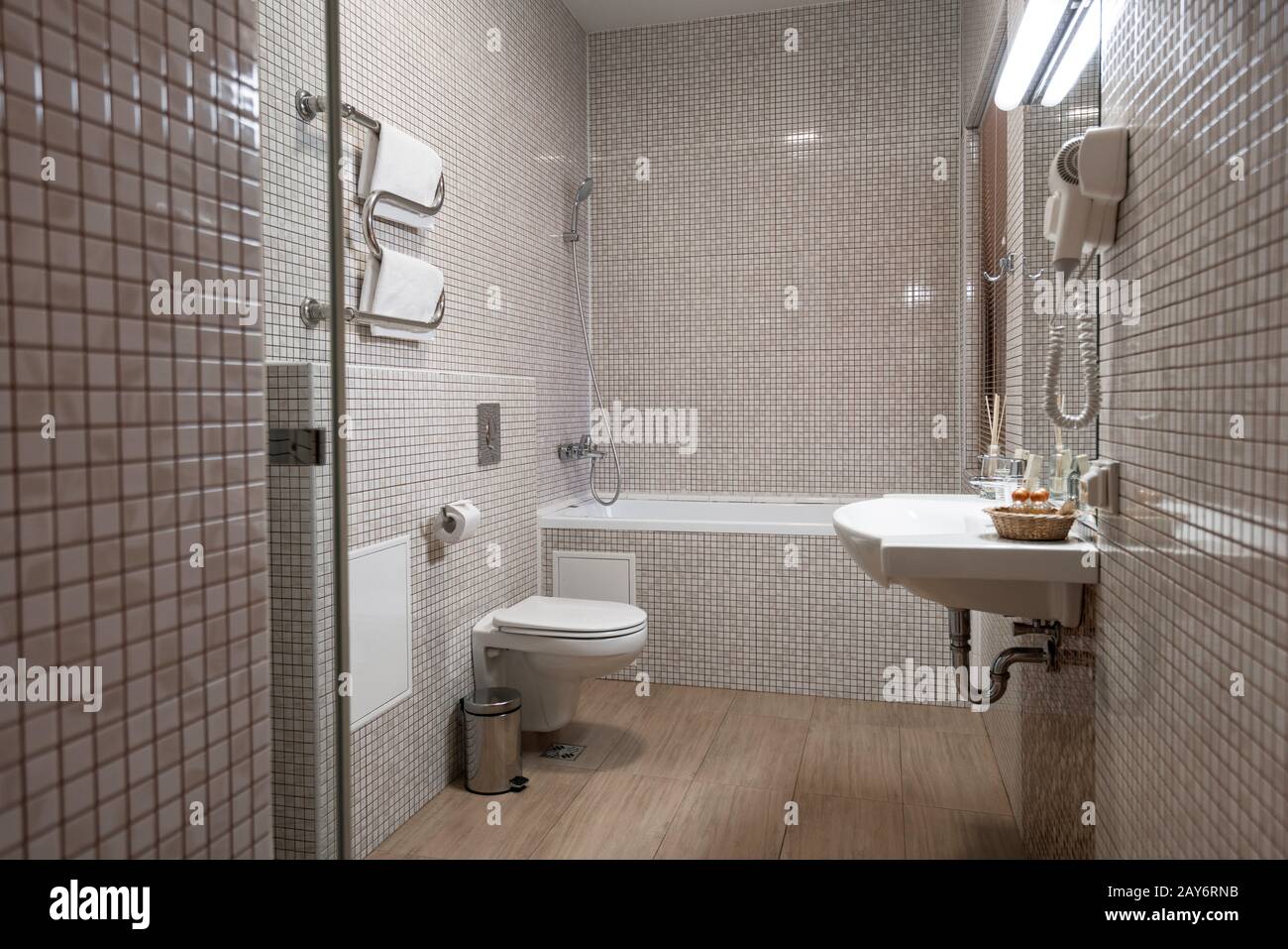 Fine hotel bathroom interior in beige and white Stock Photo
