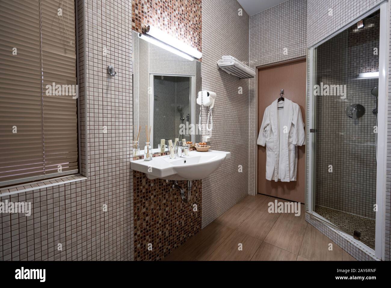 Fine hotel bathroom interior in beige color Stock Photo