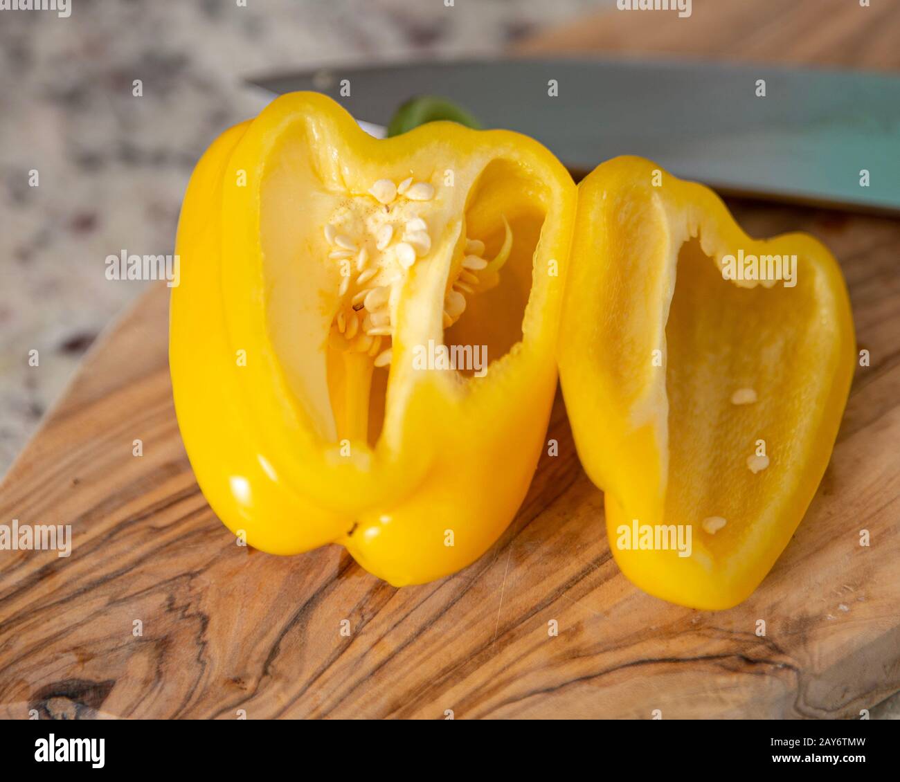 Preparing a yellow bell pepper to be cooked Stock Photo Alamy