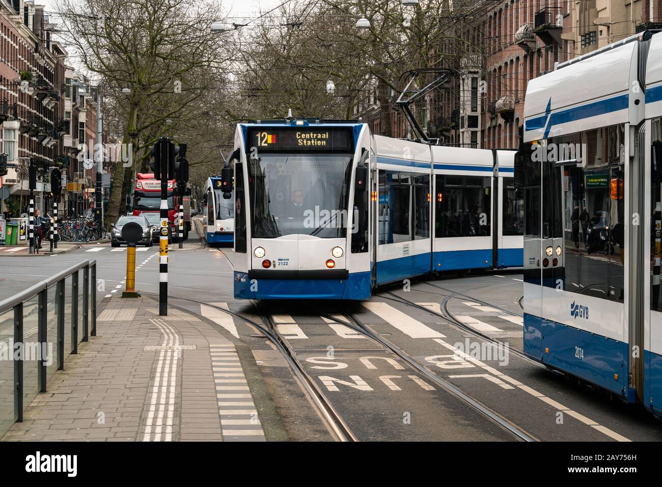 Amsterdam, Netherlands - January 30 2020: A tramway car reaches the De Pijp stop. Amsterdam has a wide electic public transportation network Stock Photo