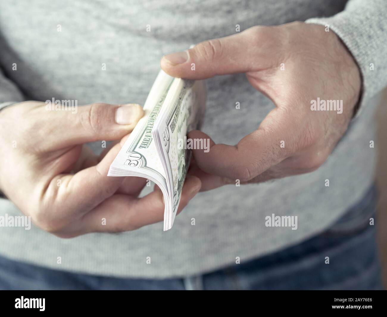 Hands counting dollars Stock Photo