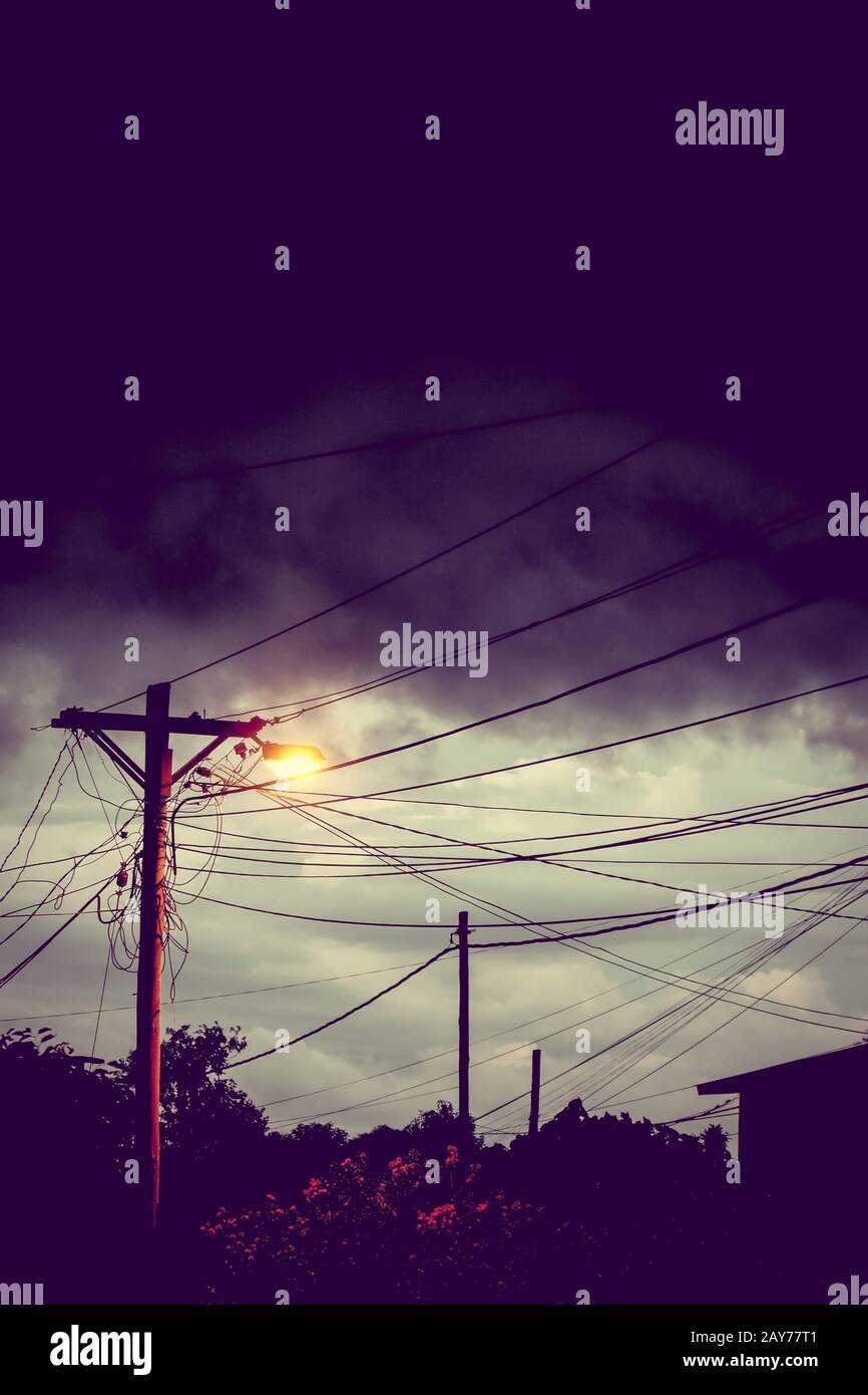 Street light at night with a stormy sky background Stock Photo