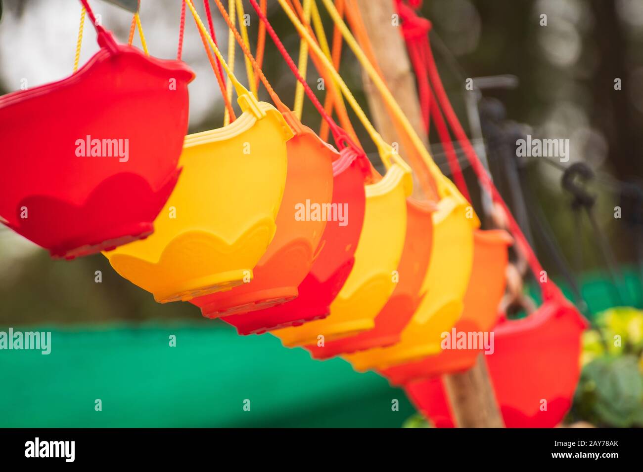 Colorful hanging flower pots Stock Photo