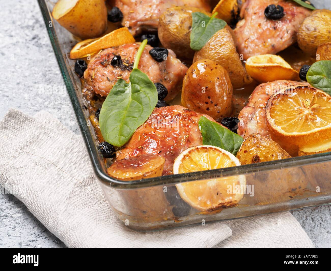 Baked chicken leg quarter with potatoes and lemon Stock Photo Alamy