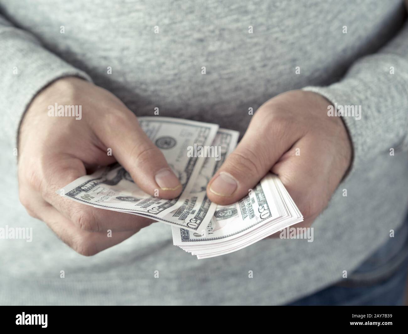 Hands counting dollars Stock Photo
