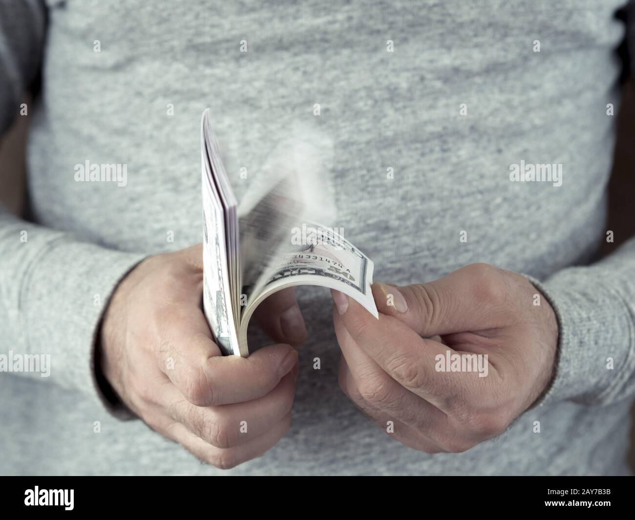 Hands counting dollars Stock Photo