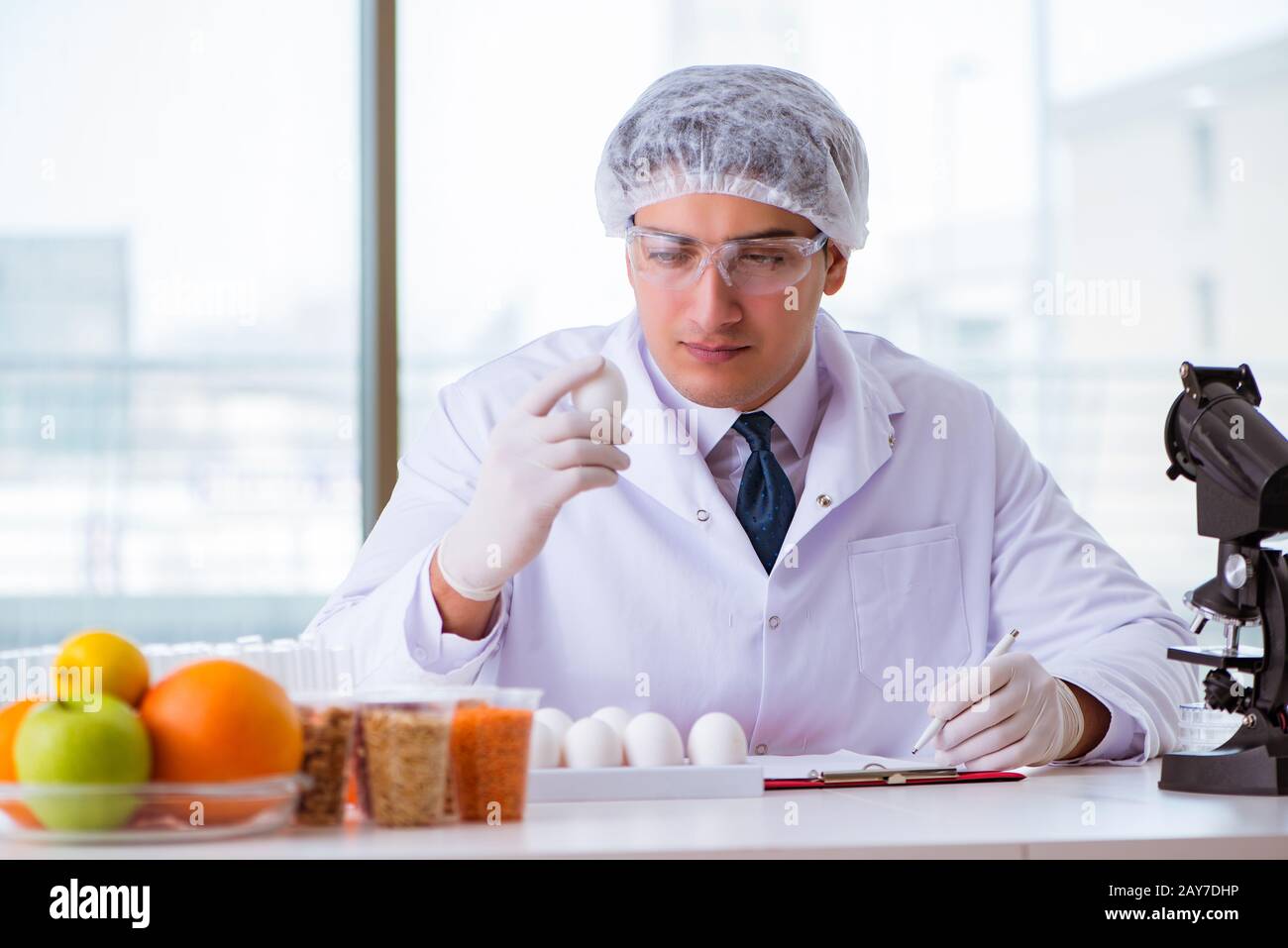 Nutrition expert testing food products in lab Stock Photo Alamy