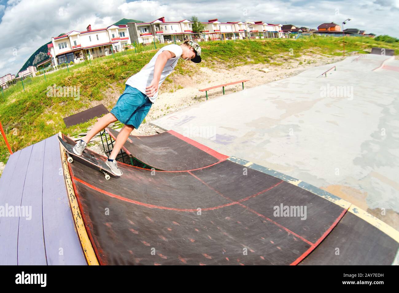 Young boy doing the trick on the ramp Stock Photo - Alamy