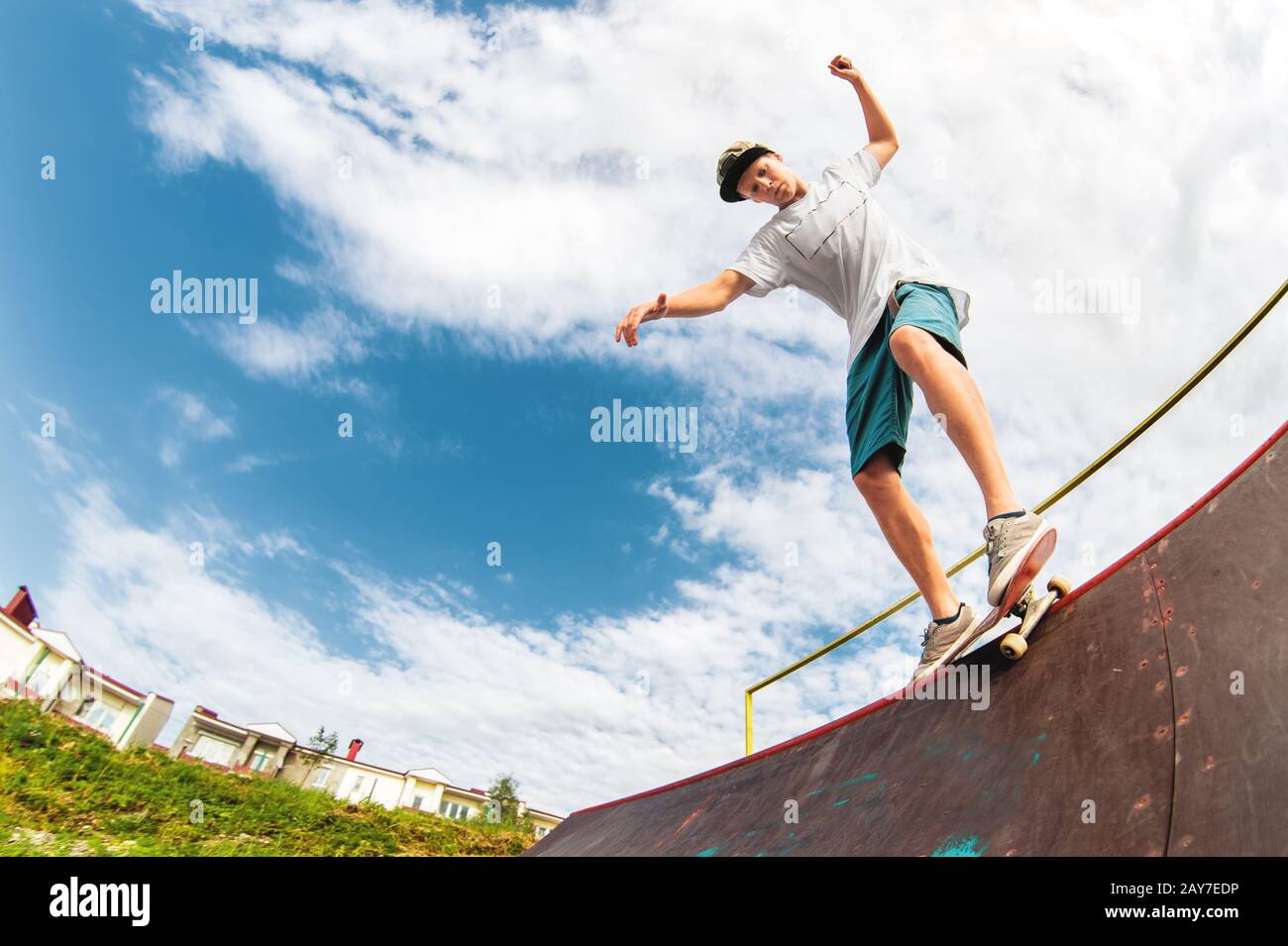 Young boy doing the trick on the ramp Stock Photo - Alamy