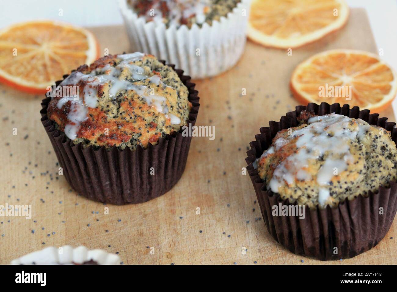 Muffins with poppy seeds and oranges. Healthy, homemade sweets, muffins with nuts. Tasty and healthy poppy seed muffins. fantastic take-out snack. Stock Photo