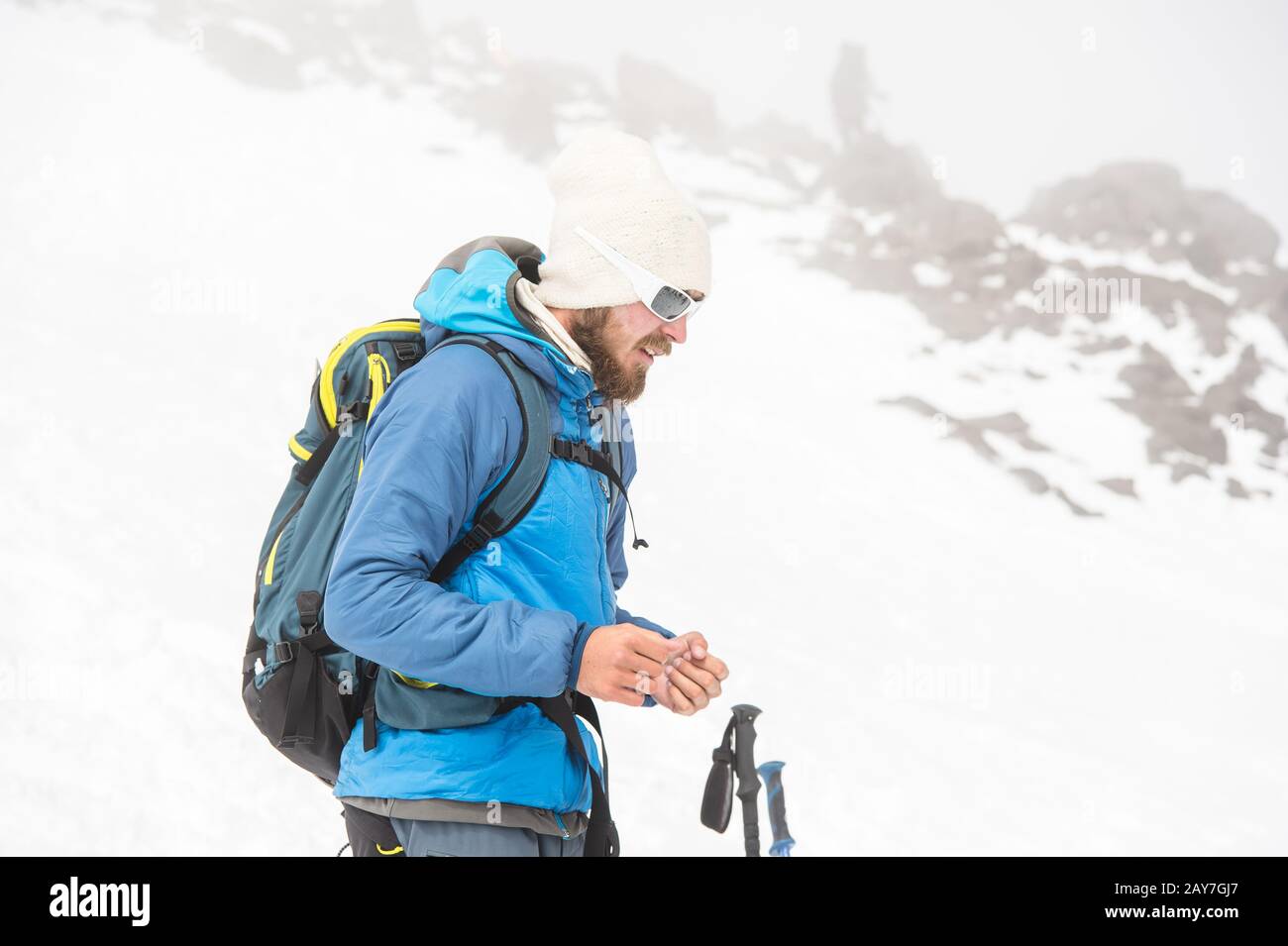 A team of climbers led by a guide discusses the upcoming ascent Stock Photo