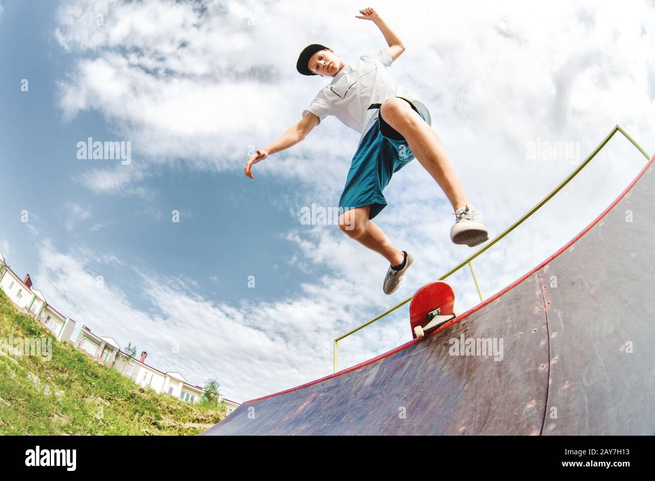 Young skater jumps from ramp down Stock Photo Alamy