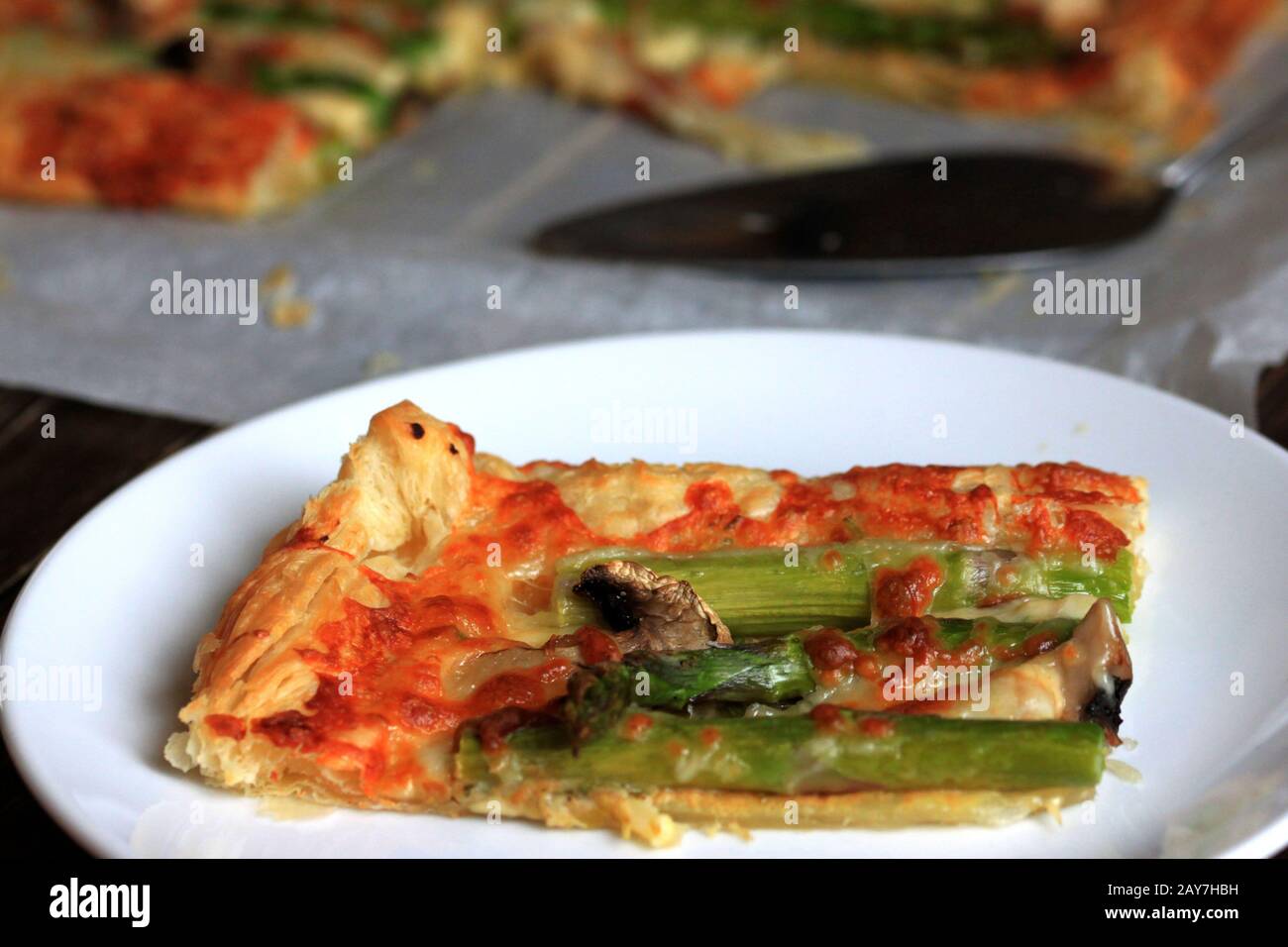 Puff pastry with asparagus and cheese. A delicious and quick snack from puff pastry. A perfect and tasty dinner. Stock Photo