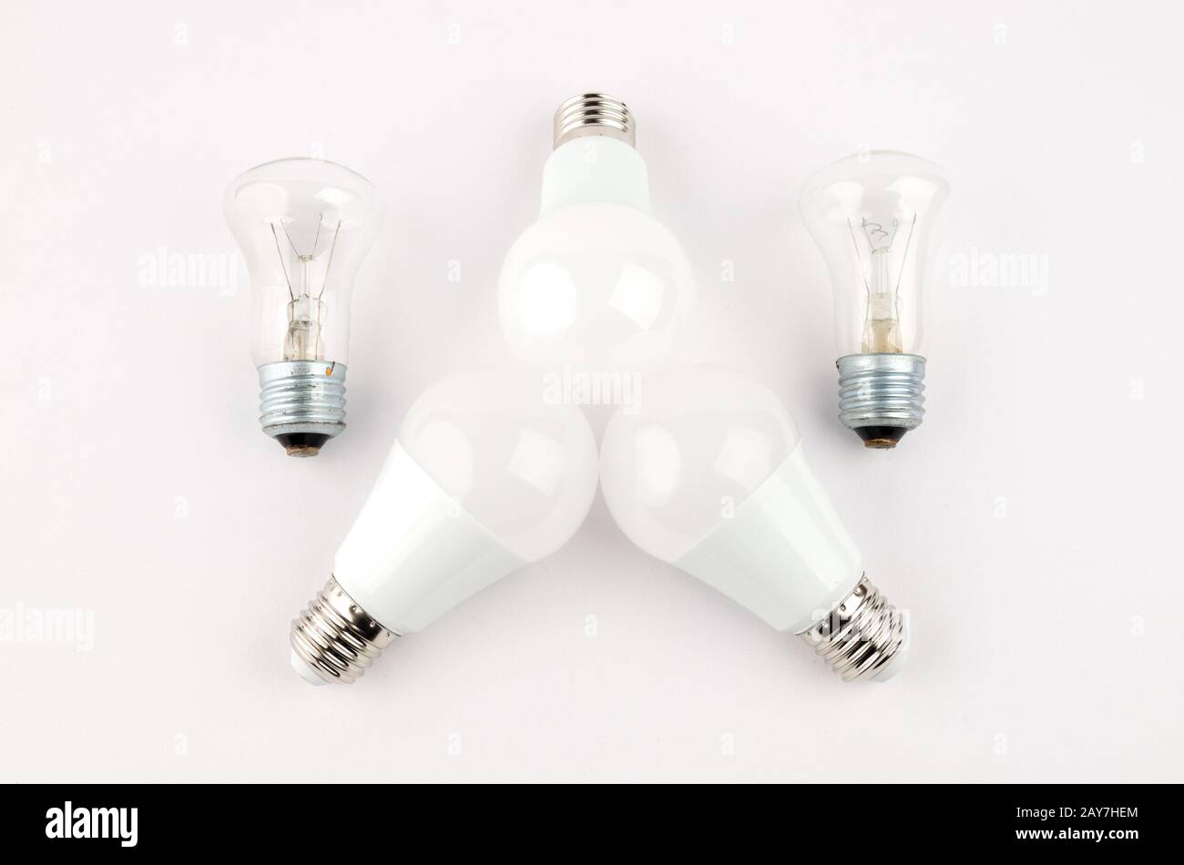 several LED energy saving light bulbs over the old incandescent, use of economical and environmentally friendly light bulb conce Stock Photo