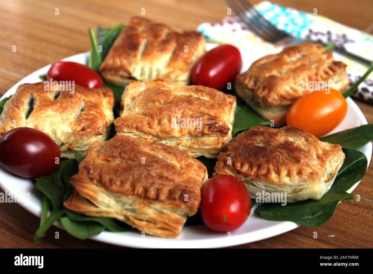 French pastry with spinach. Stuffed puff pastry. A tasty snack. Puff
