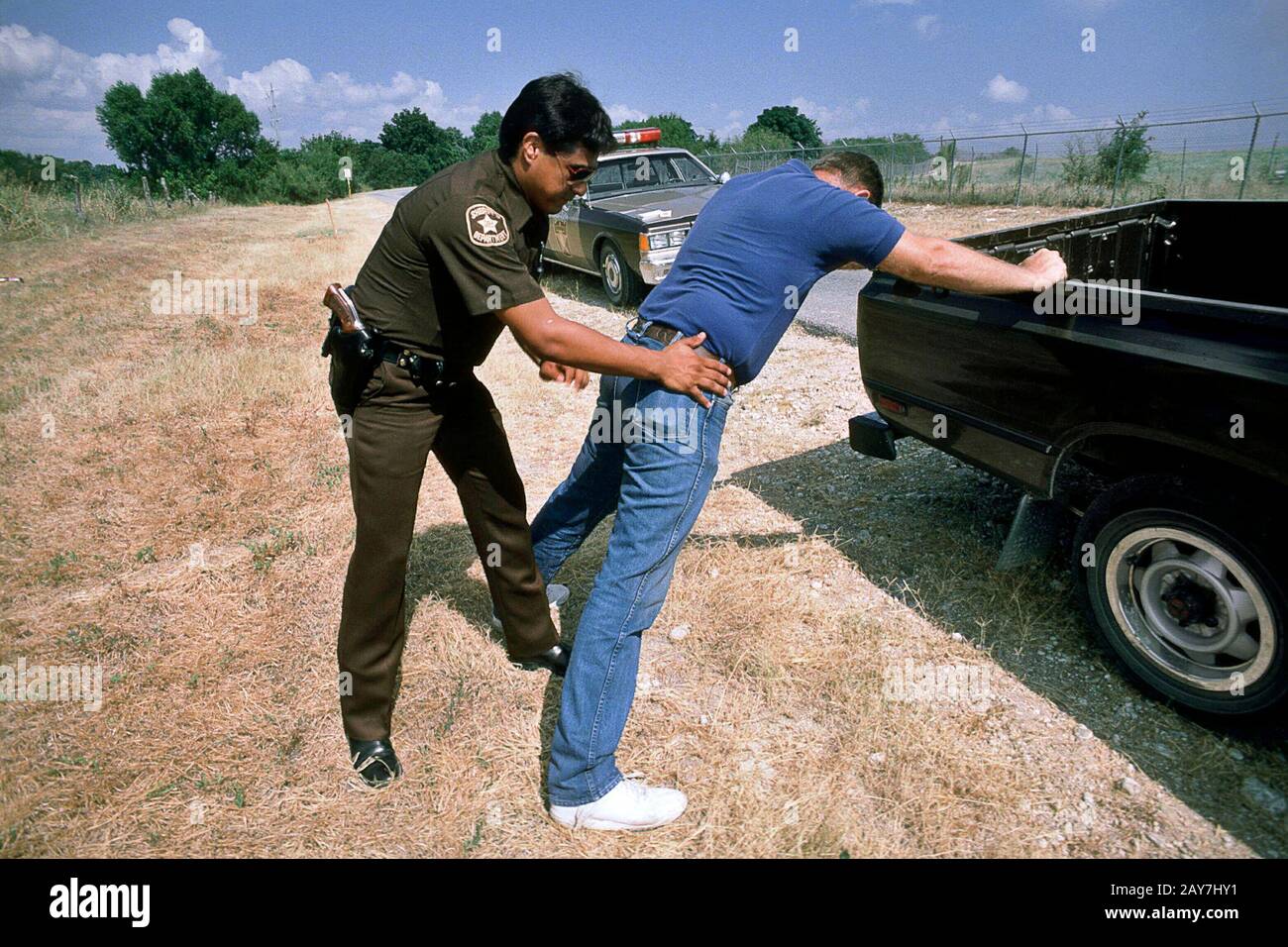 Travis County, Texas: Policeman arrests motorist. ©Bob Daemmrich Stock Photo