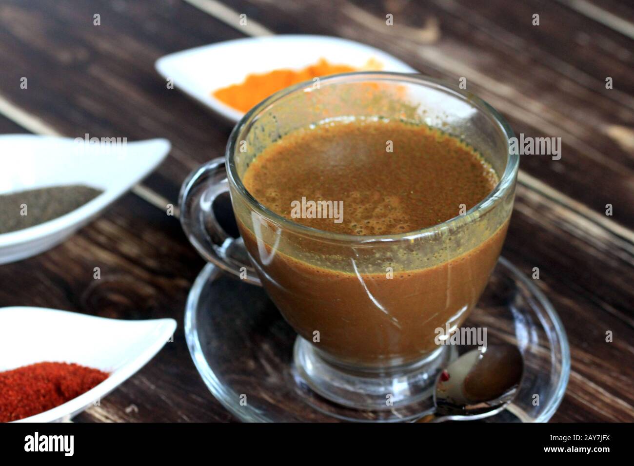 Homemade hot chocolate, golden milk, Warming drink with spices. Chocolate with turmeric, chili