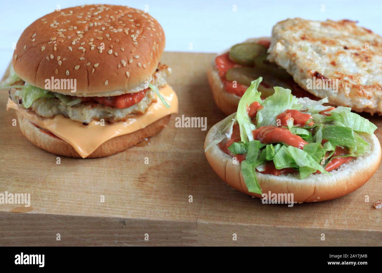 A delicious home-made hamburger with meat and vegetables.Tasty  A delicious home-made hamburger with meat and vegetables.Tasty sandwich with vegetable Stock Photo